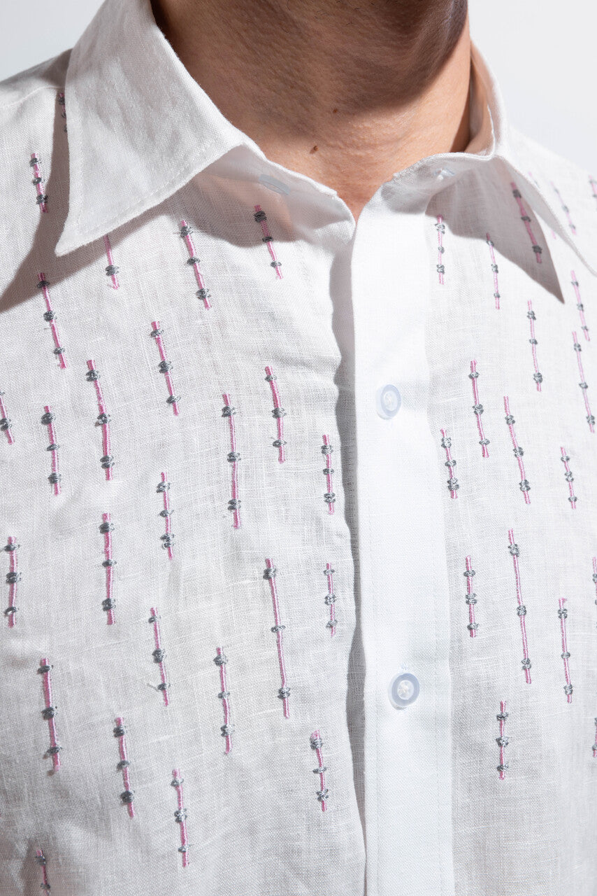 100% linen white shirt with pink embroidery.
