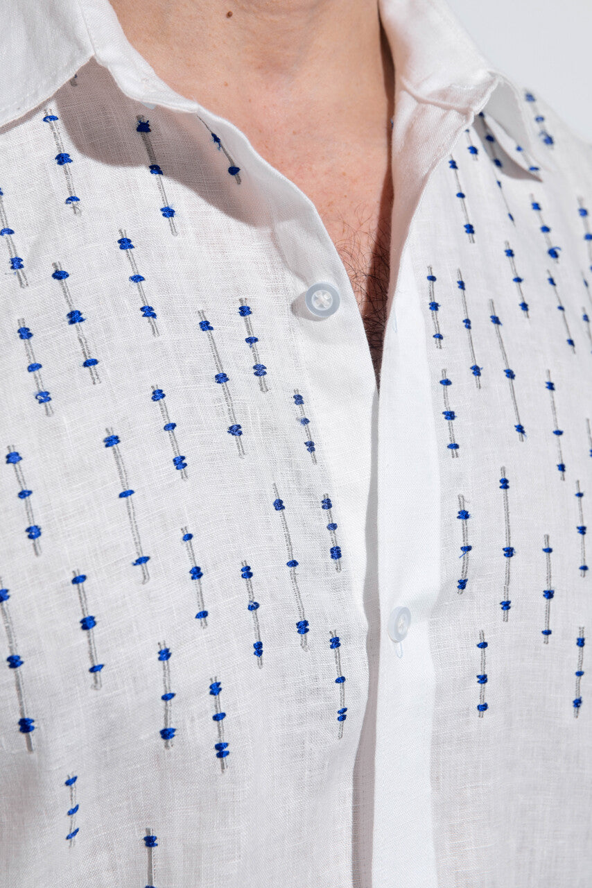 100% linen white shirt with blue embroidery.