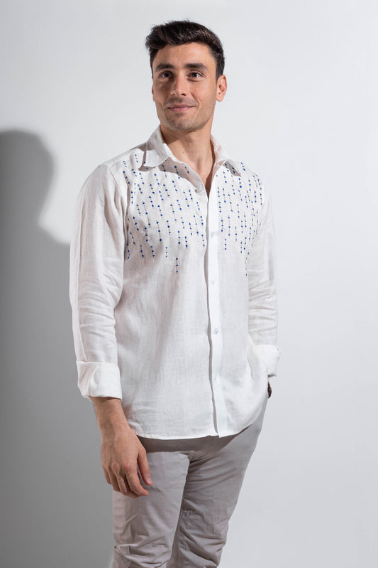 100% linen white shirt with blue embroidery.